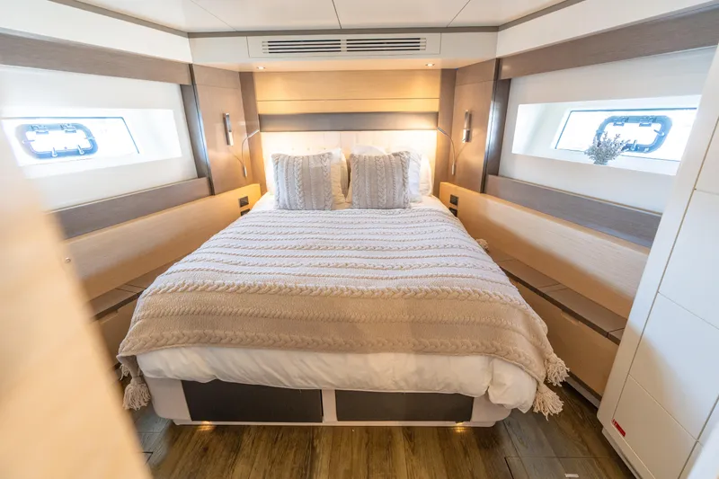 Slide: The Image of Luxurious bedroom interior of 2019 Sirena 64 yacht with cozy bedding and modern design. - 47