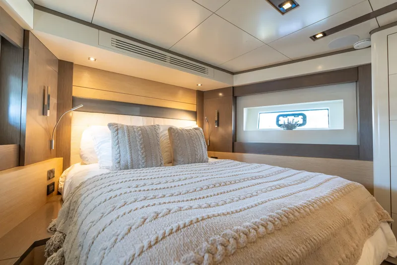 Slide: The Image of Luxurious bedroom interior of 2019 Sirena 64 yacht with cozy bedding and modern design. - 48