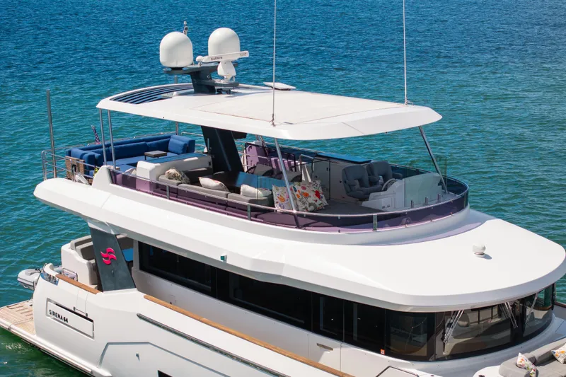 Slide: The Image of Luxurious 2019 Sirena 64 yacht with spacious deck and modern design on blue water. - 5
