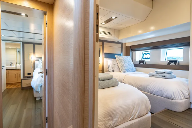 Slide: The Image of Luxurious 2019 Sirena 64 yacht interior with twin beds and modern bathroom. - 54