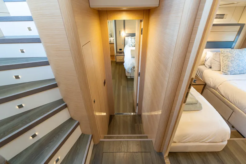 Slide: The Image of Luxurious interior of 2019 Sirena 64 yacht, featuring elegant wood finishes and cozy bedrooms. - 60