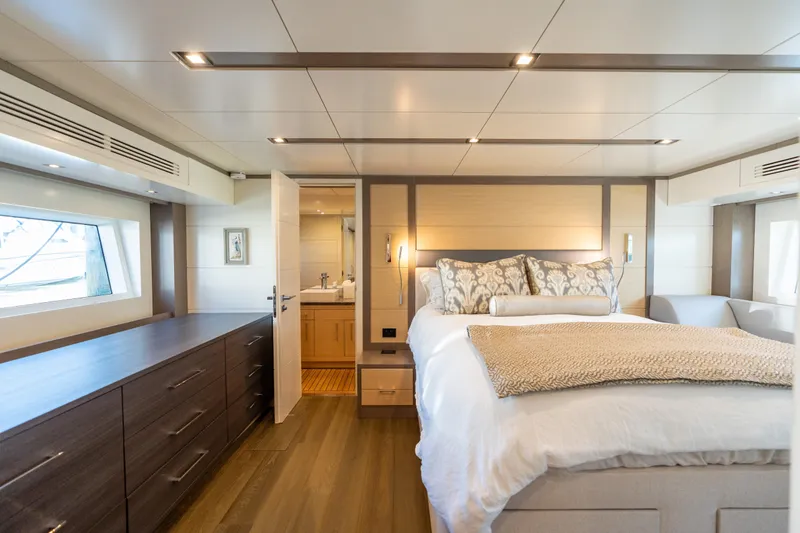 Slide: The Image of Luxurious 2019 Sirena 64 yacht bedroom with elegant decor and modern furnishings. - 61
