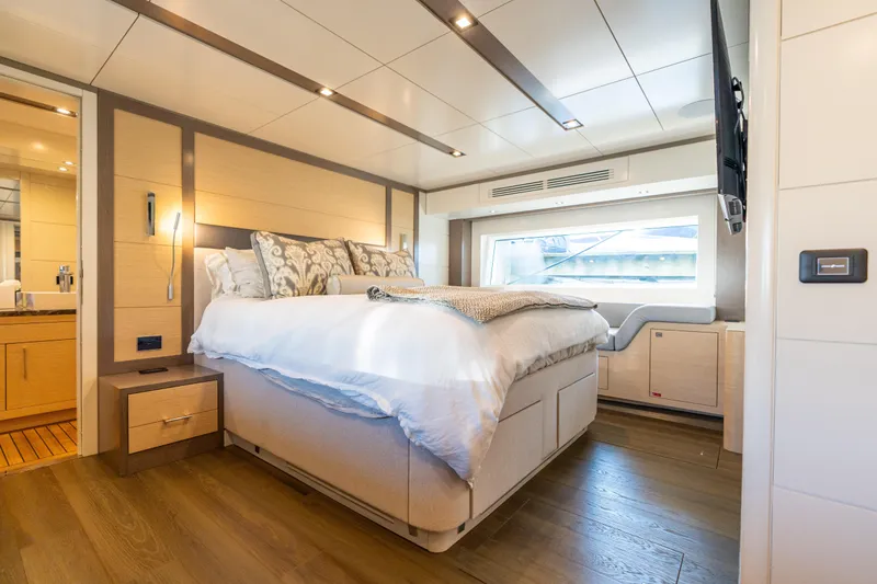 Slide: The Image of Luxurious bedroom interior of 2019 Sirena 64 yacht with modern design and large window. - 62