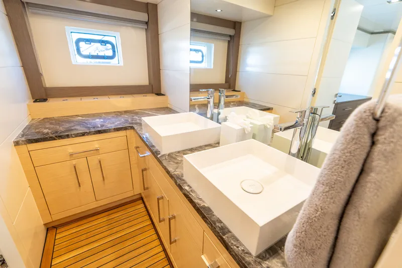 Slide: The Image of Luxurious bathroom in 2019 Sirena 64 yacht with modern fixtures and elegant design. - 65