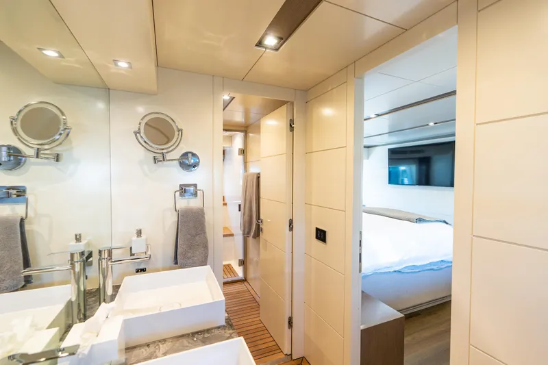 Slide: The Image of Luxurious bathroom and bedroom interior of 2019 Sirena 64 yacht, featuring modern fixtures and elegant design. - 67