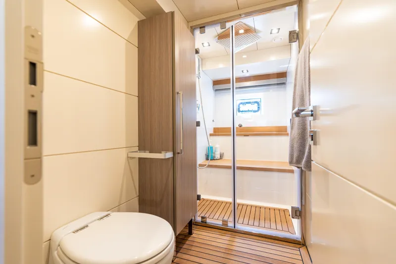 Slide: The Image of Luxurious bathroom in 2019 Sirena 64 yacht with modern shower and wooden flooring. - 69