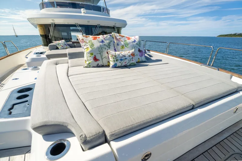 Slide: The Image of Luxurious 2019 Sirena 64 yacht with sunbed and colorful cushions on deck. - 74