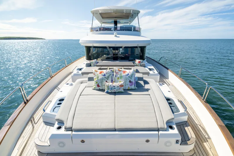 Slide: The Image of Luxurious 2019 Sirena 64 yacht deck with sun loungers and ocean view. - 76