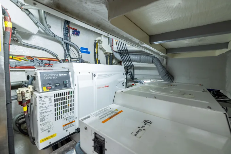 Slide: The Image of Engine room of 2019 Sirena 64 yacht with Cummins Onan generator. - 93