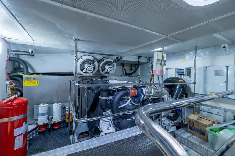 Slide: The Image of Engine room of a 2019 Sirena 64 yacht, featuring machinery and equipment. - 94