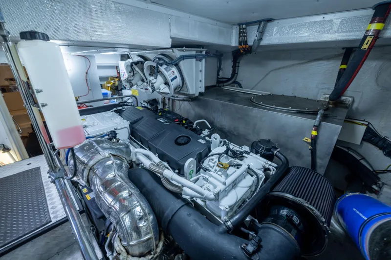 Slide: The Image of Engine room of 2019 Sirena 64 yacht, showcasing advanced machinery and components. - 96