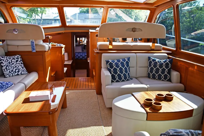 Slide: The Image of Luxurious interior of 2020 Palm Beach Motor Yachts PB52 with elegant seating and wooden accents. - 26