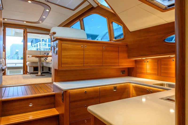 Slide: The Image of Luxurious interior of 2020 Palm Beach Motor Yachts PB52 with elegant wood finishes and modern design. - 37