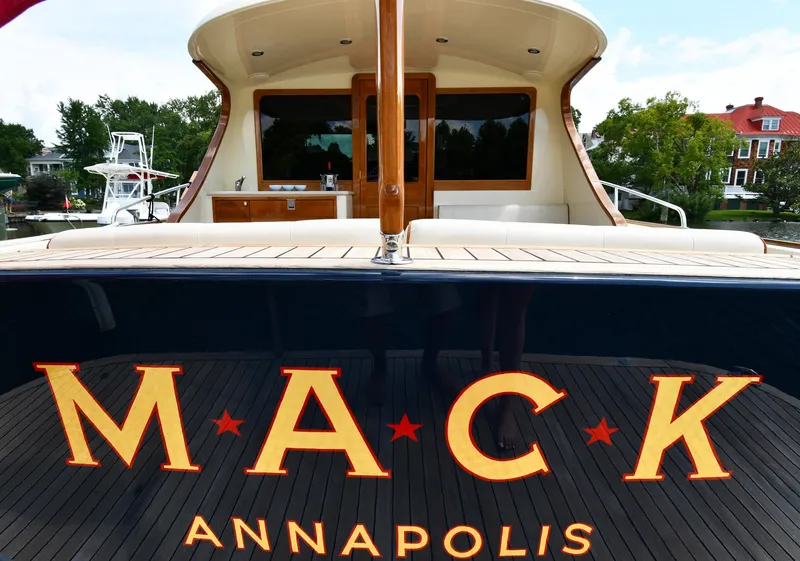 Slide: The Image of 2020 Palm Beach Motor Yachts PB52, rear view with "MACK" and "ANNAPOLIS" text. - 7