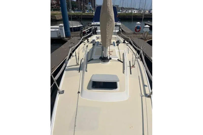 Slide: The Image of 2005 J Boats J/100 sailboat docked at marina, view of deck and mast. - 13