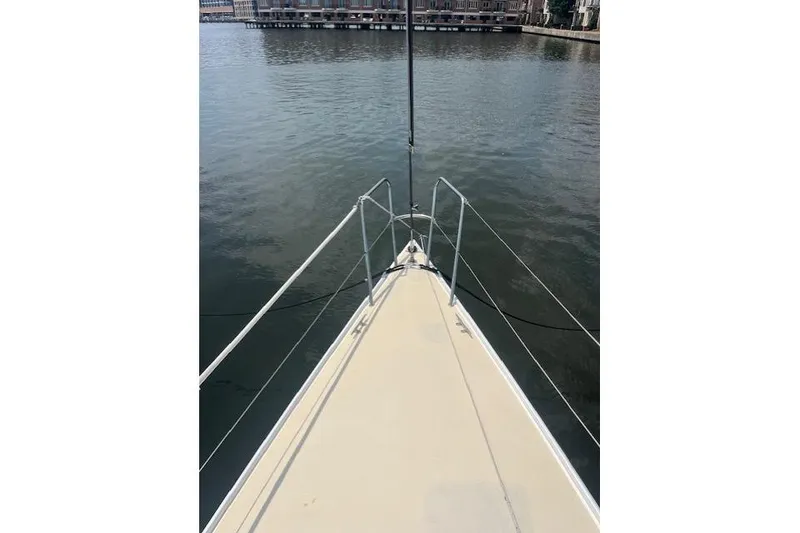 Slide: The Image of Bow view of 2005 J Boats J/100 sailboat on calm water. - 14