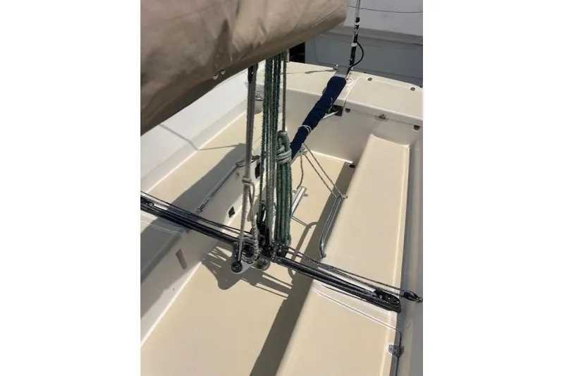 Slide: The Image of 2005 J Boats J/100 sailboat deck with rigging and ropes in sunlight. - 15