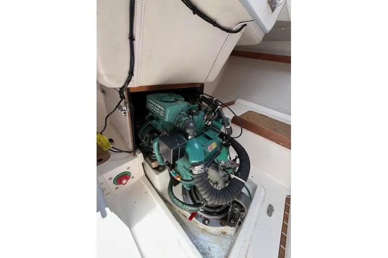 Slide: The Image of Engine compartment of a 2005 J Boats J/100 sailboat, featuring a Volvo Penta engine. - 25