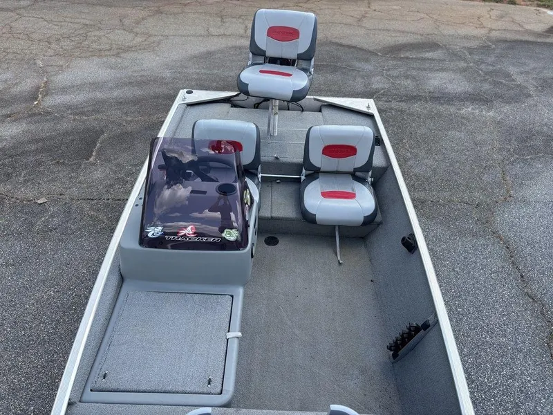 Slide: The Image of 2013 Tracker Pro 160 boat interior with seating and steering console. - 10