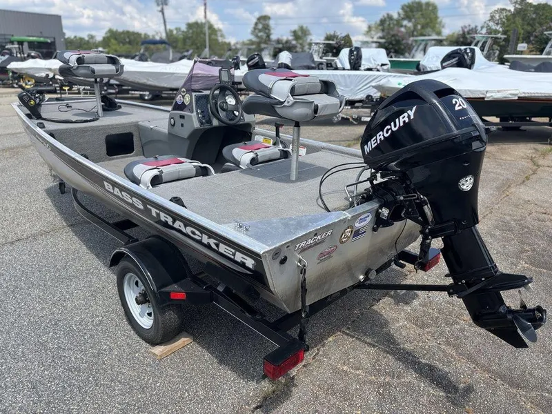 Slide: The Image of 2013 Tracker Pro 160 boat with Mercury 20HP engine, parked on a trailer. - 5