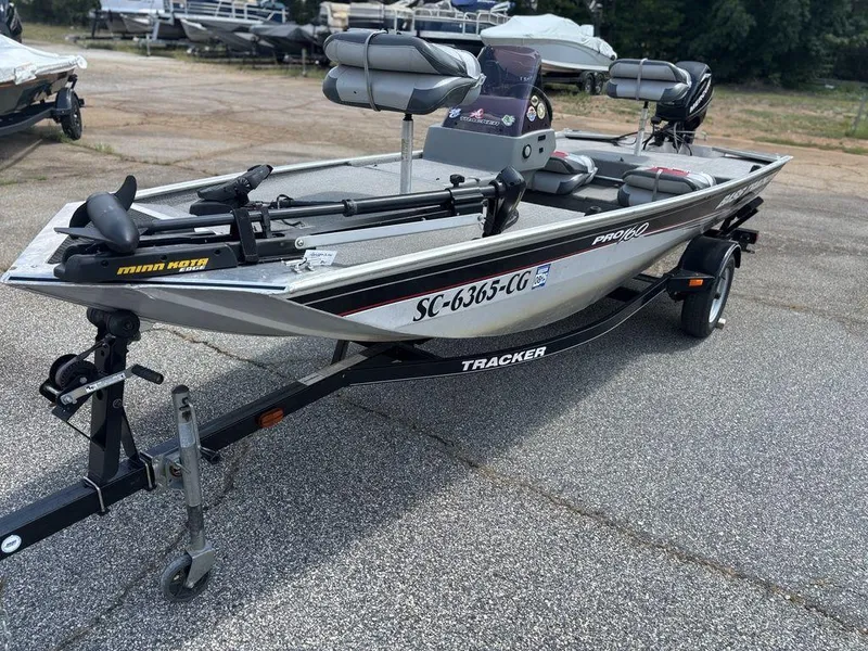 Slide: The Image of 2013 Tracker Pro 160 fishing boat on trailer, equipped with Minn Kota trolling motor. - 6