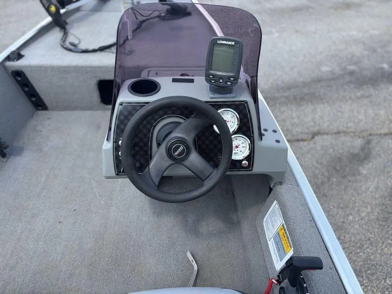 Slide: The Image of Steering console of 2013 Tracker Pro 160 boat with gauges and Lowrance fishfinder. - 7
