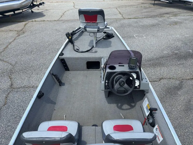 Slide: The Image of 2013 Tracker Pro 160 boat interior with steering console and seating. - 8