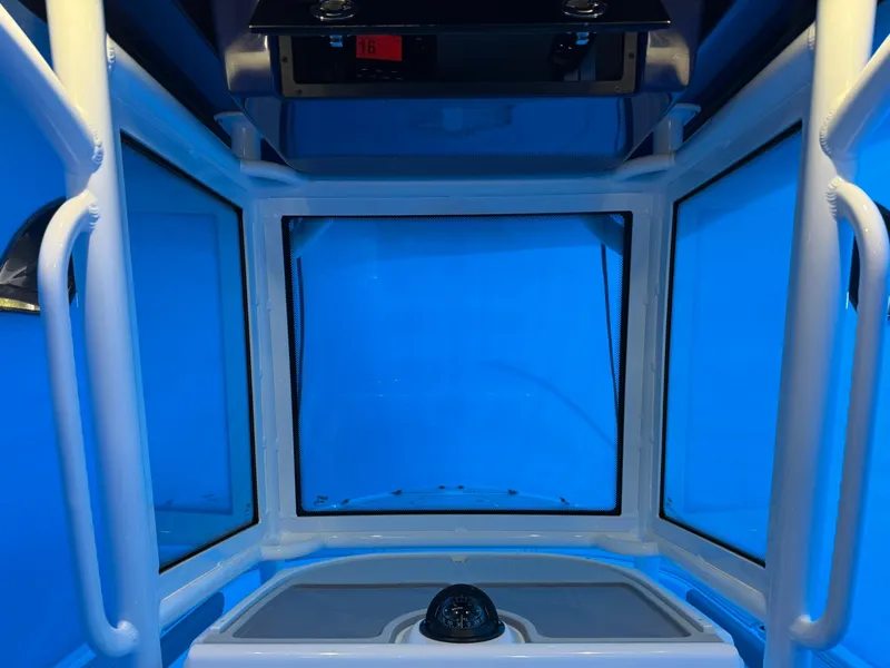 Slide: The Image of Interior view of 2024 Caymas 28 HB boat cockpit with blue lighting. - 11