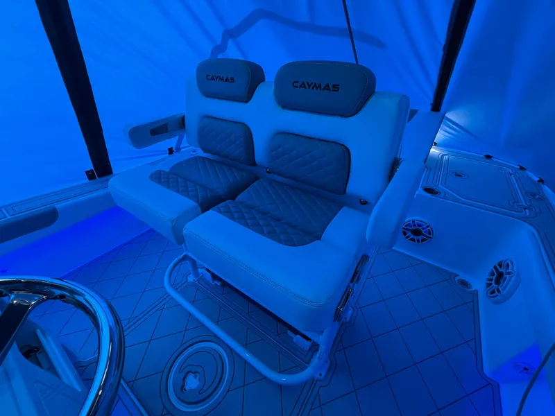 Slide: The Image of 2024 Caymas 28 HB boat interior with illuminated seating and modern design. - 12