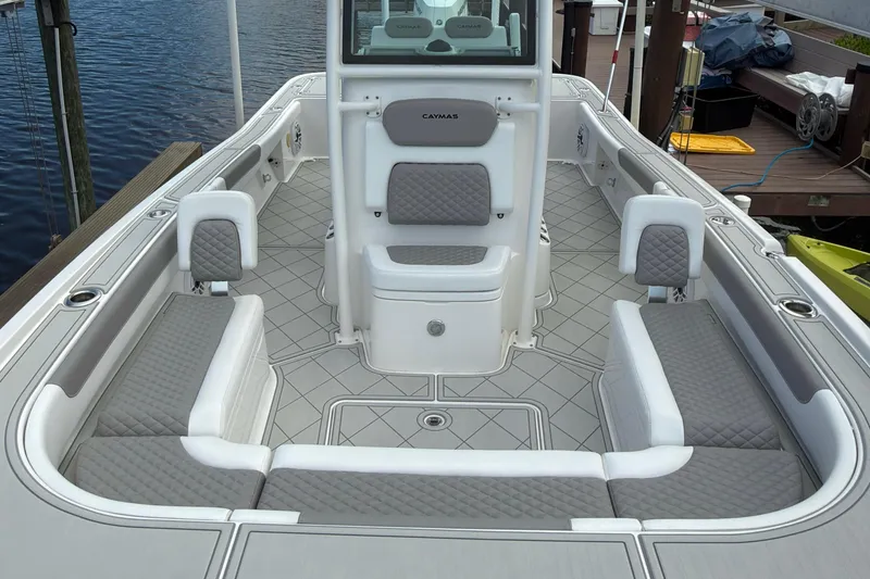 Slide: The Image of 2024 Caymas 28 HB boat interior with gray seating and modern design. - 18