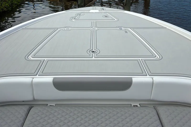 Slide: The Image of 2024 Caymas 28 HB boat deck with sleek design and textured surface. - 19