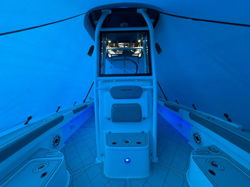 Slide: The Image of 2024 Caymas 28 HB boat interior with blue lighting and modern design. - 7