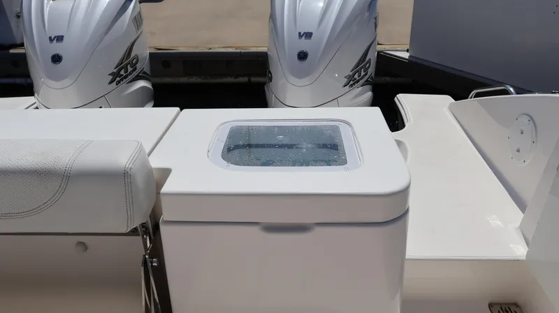 Slide: The Image of 2023 Pursuit OS 355 Offshore boat with dual outboard engines and seating area. - 17