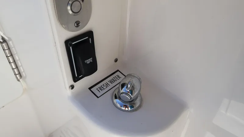 Slide: The Image of Fresh water outlet on 2023 Pursuit OS 355 Offshore boat. - 29