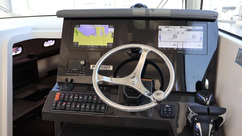 Slide: The Image of 2023 Pursuit OS 355 Offshore helm with advanced navigation displays and controls. - 34
