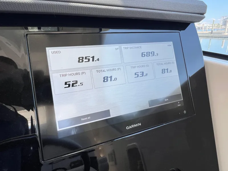 Slide: The Image of Garmin display on 2023 Pursuit OS 355 Offshore showing fuel usage and trip data. - 35