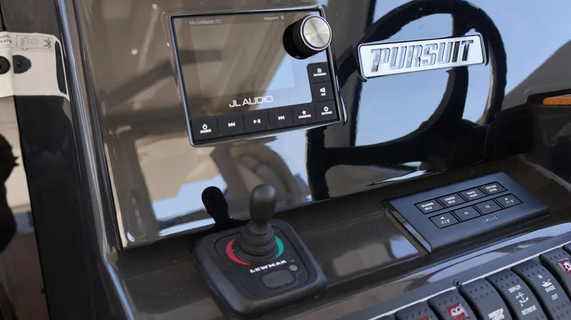 Slide: The Image of Control panel of 2023 Pursuit OS 355 Offshore boat with JL Audio system. - 38
