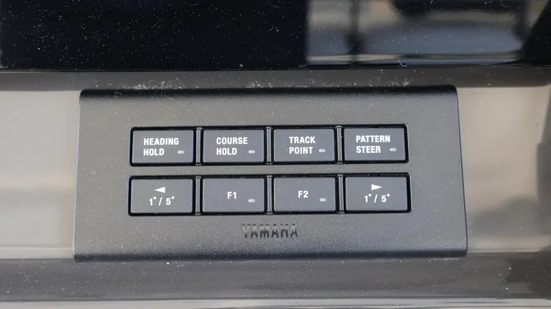 Slide: The Image of Control panel of 2023 Pursuit OS 355 Offshore boat with Yamaha navigation buttons. - 40