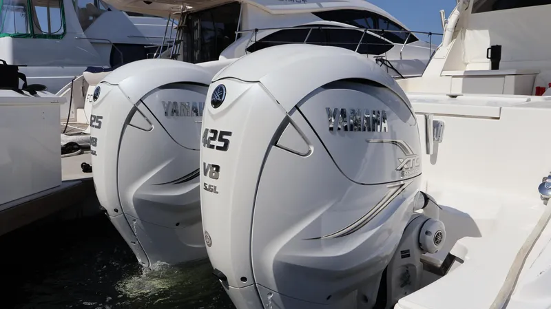 Slide: The Image of Twin Yamaha 425 V8 engines on a 2023 Pursuit OS 355 Offshore boat. - 9