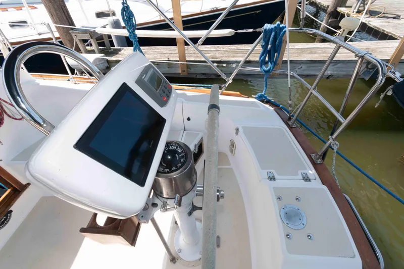 Slide: The Image of Cockpit of a 1994 Tartan 31 sailboat with navigation equipment and compass. - 5