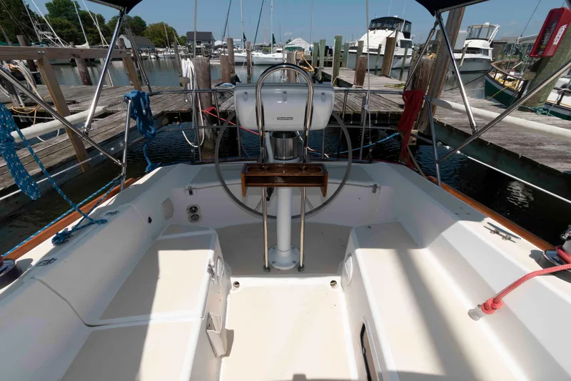 Slide: The Image of Cockpit of a 1994 Tartan 31 sailboat docked at a marina. - 6