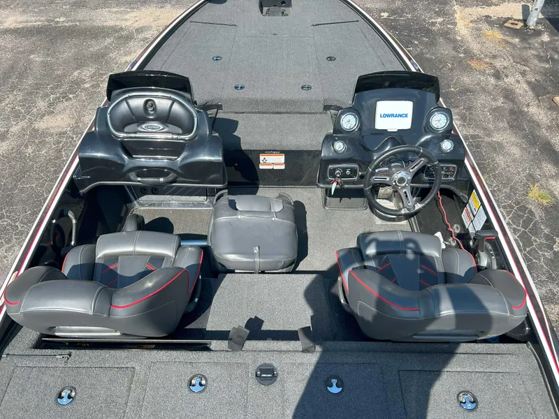 Slide: The Image of 2018 Nitro Z19 boat interior with dual consoles, steering wheel, and seating. - 4