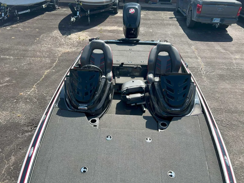Slide: The Image of 2018 Nitro Z19 boat with dual seats and storage compartments on a trailer. - 6