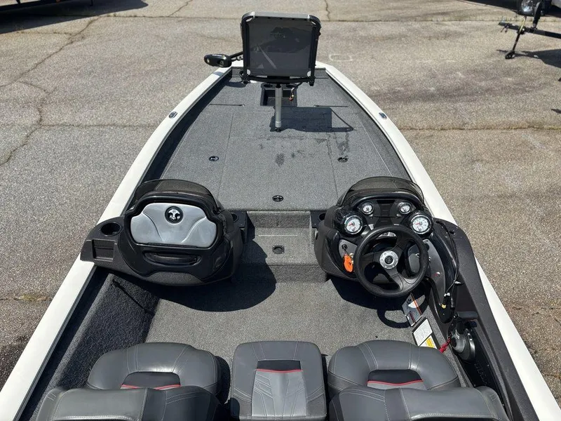Slide: The Image of 2013 Tracker Pro Team™ 190 TX boat interior with steering console and seating. - 11