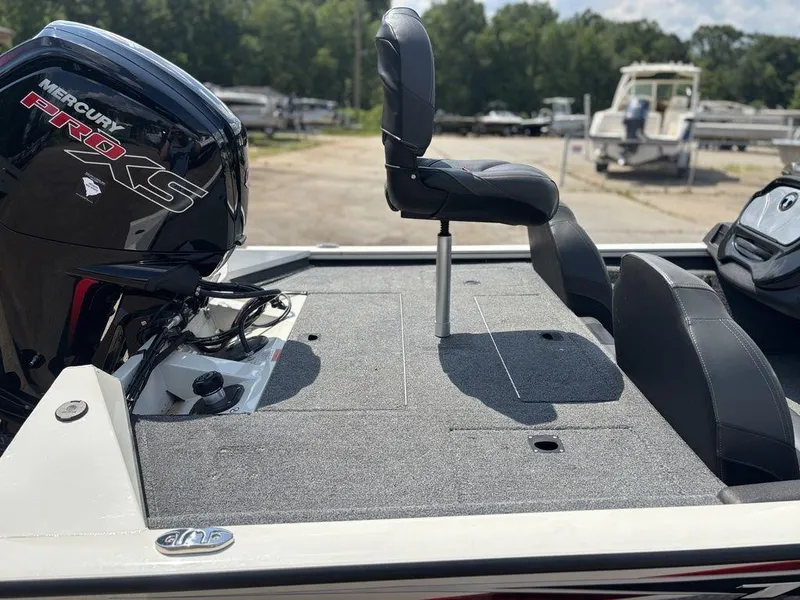 Slide: The Image of 2013 Tracker Pro Team™ 190 TX boat with Mercury Pro XS engine, featuring a spacious deck. - 12