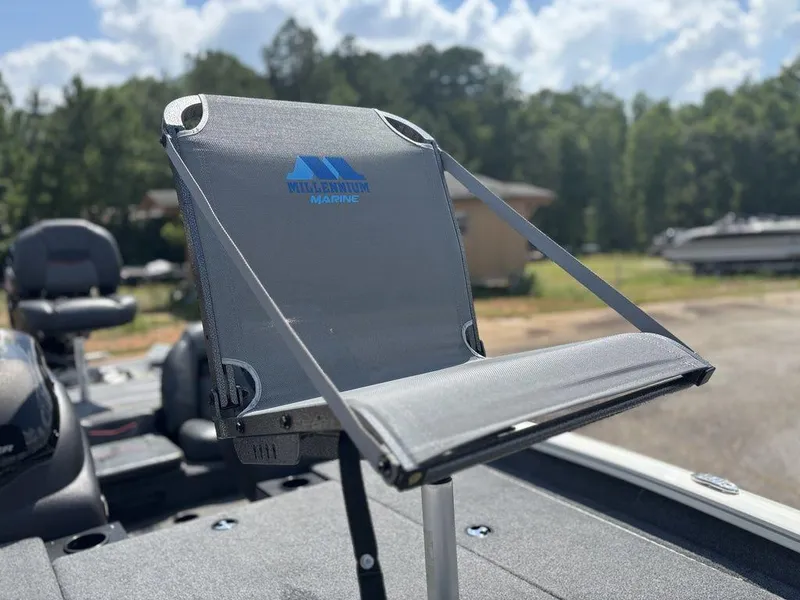 Slide: The Image of 2013 Tracker Pro Team™ 190 TX boat with Millennium Marine seat, outdoors. - 13