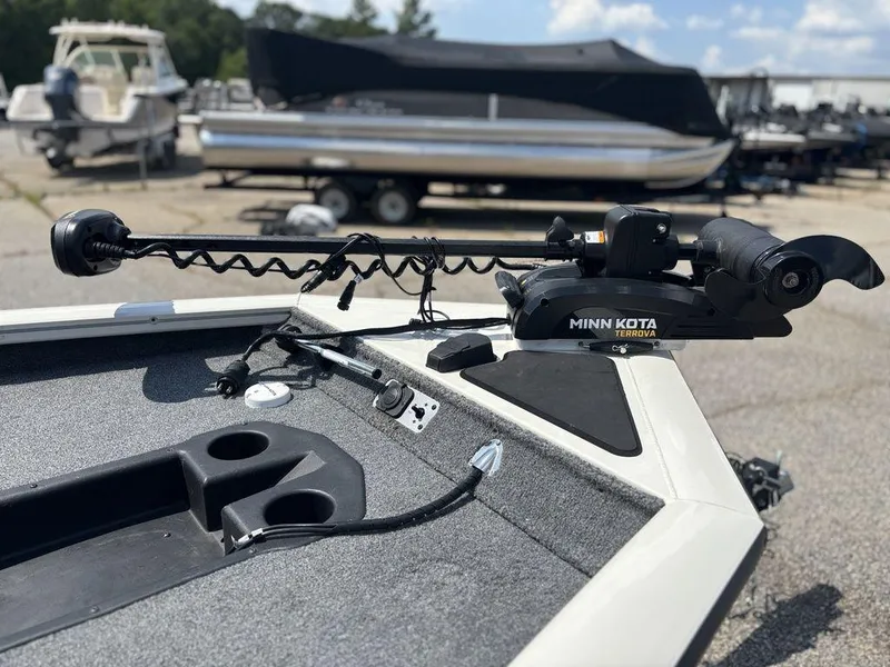 Slide: The Image of 2013 Tracker Pro Team 190 TX with Minn Kota Terrova trolling motor, docked outdoors. - 15