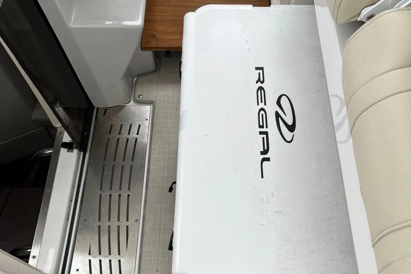 Slide: The Image of 2022 Regal 33 SAV boat interior with branded seating and sleek design. - 16