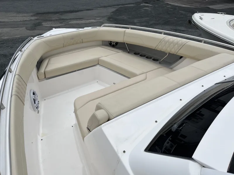 Slide: The Image of 2022 Regal 33 SAV boat with spacious beige seating area. - 21
