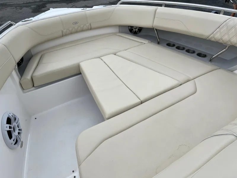 Slide: The Image of Luxurious seating area on 2022 Regal 33 SAV boat with beige upholstery. - 22
